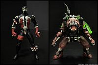 Front view of two 1990s Spawn action figures by McFarlane, side by side on black background.