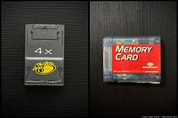 Both memory cards shown side by side on black surface, one black Mad Catz 4X GameCube Memory Cube and one red Nintendo 64 Memory Card
