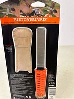 Front view of package showing leather strop pouch and diamond sharpener inside blister pack with product details on backing card.