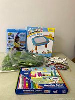 Full lot of kids toys including art supplies, magnetic drawing board, dinosaur toys, and activity book.