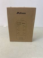 Photo of the Mifaso surge plug in original brown cardboard packaging featuring the brand logo and product illustration.
