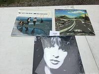 Three vinyl album covers and front shown, including Year Zero, Kraftwerk Autobahn, and a black and white portrait album.