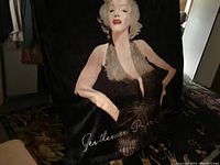 Black oversized queen fleece blanket featuring a printed image of Marilyn Monroe in a black dress with white hair, text 'Gentlemen Prefer...'.