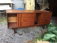 Full view of the vintage solid oak dresser showing sliding doors and drawers on the right.