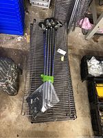 Set of 5 metal wire shelves stacked on one another.