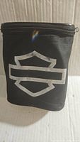 Black zippered carrying pouch with Harley Davidson shield logo displayed on front