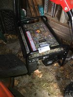 Left-side view showing camouflage fuel tank and tubular steel frame with fallen leaves