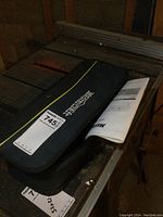 Mastercraft AC Multi Crafter soft carrying case closed with manual partially visible.