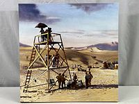 Front view of the entire 20x20 canvas print showing the desert movie crew scene on scaffolding and ground.