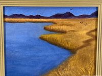 Close-up front view of the oil painting showing the water, grass, mountain, and sky.
