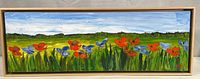 Full view of the framed panoramic landscape painting showing red poppies and blue flowers with hills and sky