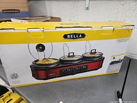 Photo of Bella Triple Slow Cooker Buffet & Serve in original box showing the product and branding.