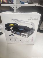 Box of iConvert USB turntable showing branding, features and product image.