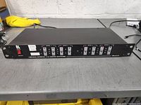 Front view of Kramer VIS-4x4 Matrix Switcher showing panel with buttons and labels for different input types.