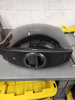 Full top and front view of the large Sony projector showing the curved top surface and brand name.