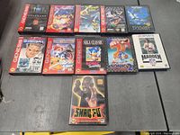Photo showing all 11 Sega Genesis games in cases laid out on a table with visible titles and artwork for visual confirmation.
