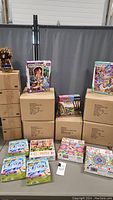 Overview photo showing the stacks of puzzle boxes and labeled cartons.