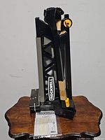 Rockwell Jawhorse in folded state showing front label and pamphlet on wooden table.