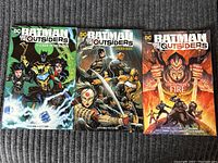Lot of 3 Batman and the Outsiders comic books showing front cover artwork and titles.