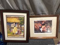 Both framed pictures presented side by side on fabric backdrop. Shows full frames and artwork.