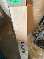 Cardboard box with Neewer printed on the side.