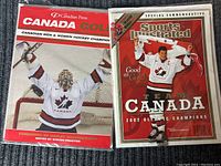 Both magazines side by side showing front covers, both bagged and boarded.