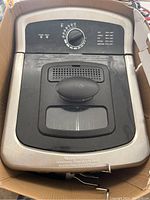 Top view of Farberware deep fryer showing control panel with temperature dial, power and ready lights, and viewing window on lid.