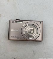 Front view of Kodak Easyshare Touch digital camera showing lens and front casing with 5X optical zoom label