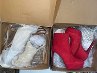 Two boxes with one pair of beige heels in the left box and one pair of red heels in the right box, wrapped in plastic and paper inside shoe boxes.
