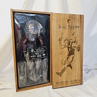 Buck Rogers figure and accessories secured inside plastic tray within wooden slide-top box.