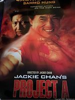 Poster showing Jackie Chan and Sammo Hung in martial arts action poses with red background labeled 'Project A'