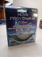 Original Hoya PRO1 Digital filter box with label stating 72mm, protector filter branding and other details.