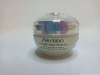Front view of the cream jar showing Shiseido branding and product name with SPF 20 indication