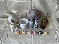 All items grouped on a beige couch showing variety and size