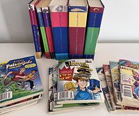 Assorted Archie comics scattered and stacked horizontally including Jughead comic issues and a Pals and Gals comic book with cover art visible.