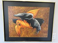 Framed mixed media oil painting showing two birds in flight against textured brown background, signed Amy Mann.