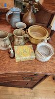 Group photo showing all pottery items on wooden surface