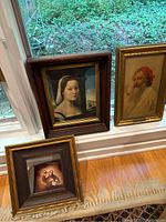 Framed portraits arranged on floor near window showing full view and sizes, which range from 11x11 to 14x12 inches.
