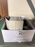 Box containing cameras, flahses, lens filters, and accessories