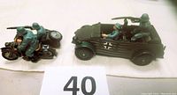 Side view of the German motorcycle with sidecar and Scout Car with detailed soldier figures and army green paint.