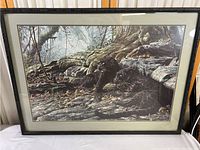 Full view of framed Dawn Alert poster showing two black panthers in forest environment.