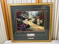 Full view of framed Thomas Kincade Springgate print in gold frame