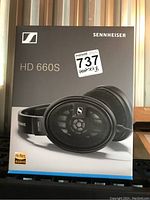 Front of sealed retail box showing product image, model name and hi-res audio logo