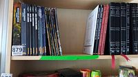 Shelf overview showing Warhammer 40,000 rulebook, nine slim codex, Imperial Armour and Horus Heresy novels