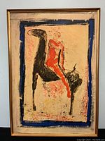 Full view of the framed abstract art print depicting a man on a horse with visible colors and frame, giving a good sense of size and condition.