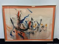 Framed abstract watercolour painting by William Newcombe, signed. Shows full painting and frame with orange mat, mostly abstract blue, black, orange colors.