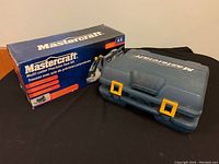 Photo of the Mastercraft Multi-cutter Precision Saw Kit box and blue plastic carrying case with yellow latches for the angle grinder.