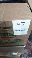 Box labeled with number 47, sealed taped cardboard packing box for the vinyl records