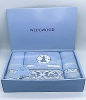 3-piece Wedgwood towel set in open branded box, showing arranged towels with labels and tags, sky blue color
