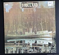 Front cover of the vinyl LP showing the title "The Beach Boys Holland" with a reflected image of a boat and buildings.